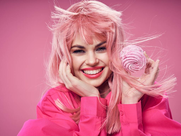 cheerful glamorous woman with pink hair cake sweets - Фото, изображение