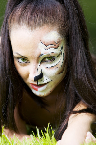 Girl with tigress make up close up portrait - Foto, afbeelding