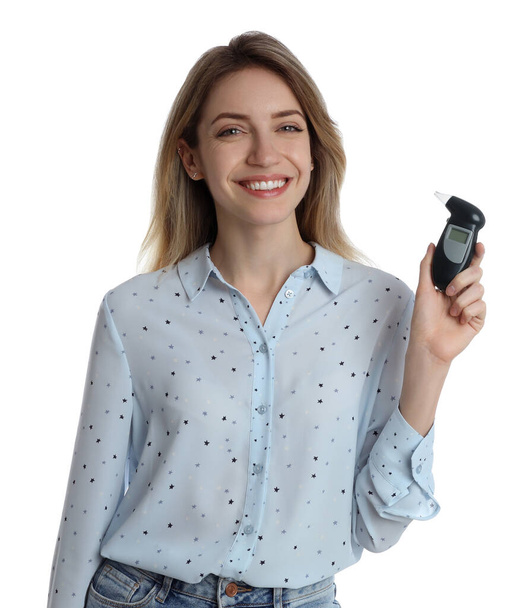 Young woman with modern breathalyzer on white background - Zdjęcie, obraz