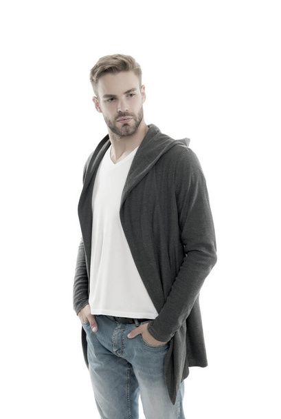 Casual and comfortable. Male fashion influencer. Fashionable model man. Street style outfit. Handsome man with hood standing white background. Fashion trend. Clothes daily wear. Menswear concept - Фото, изображение
