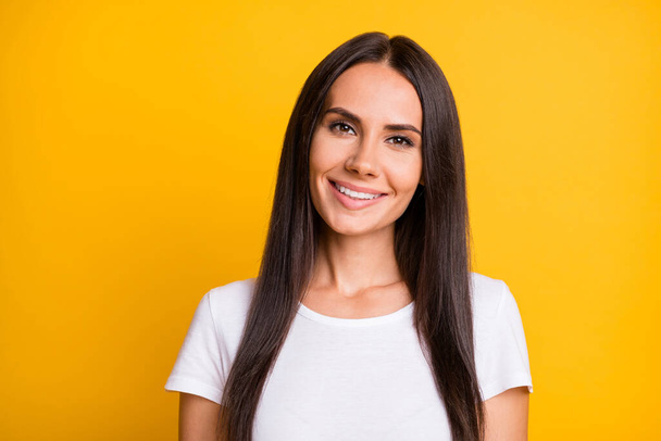 Photo of young cheerful woman happy positive smile wear white t-shirt isolated over yellow color background - Valokuva, kuva