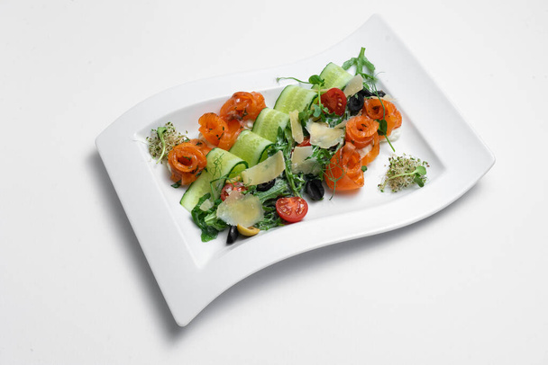 closeup of salad with lightly salted salmon and vegetables on white background - Fotografie, Obrázek