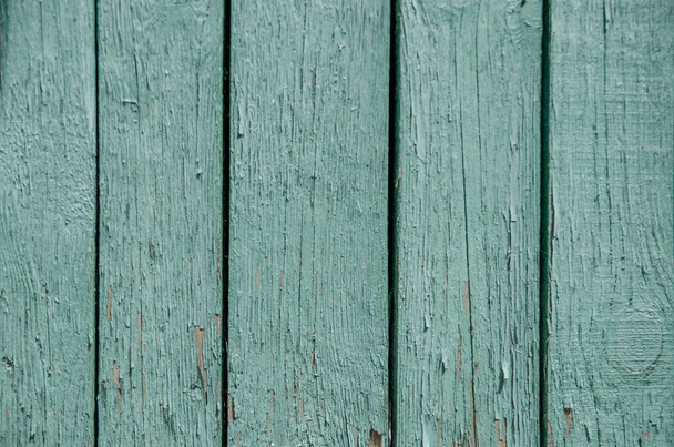 Background from structural green old wooden planks. Vintage background of faded green paint boards - Foto, afbeelding
