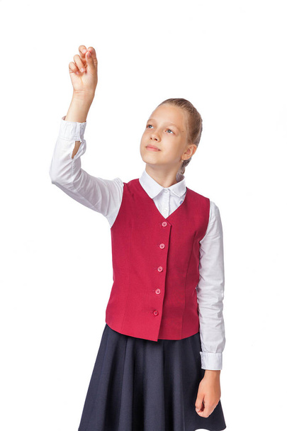 Hátsó nézet iskolás lány írás gesztus a levegőben elszigetelt fehér háttér. Egy lány iskolai egyenruhában. Stúdió fotó, oktatás - Fotó, kép