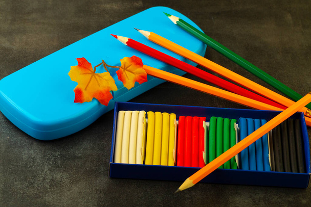 school supplies for studying on a dark background, close-up - Photo, Image