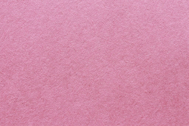 Seamless pink construction paper background wallpaper. Stock Photo