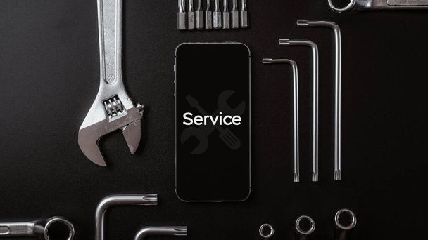 Phone service. Technician workplace with phone and special repairing tools. Cellphone technology device maintenance engineer - Photo, Image