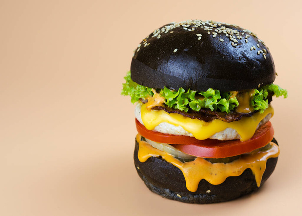 chicken burger in a black bun 3 - Photo, Image