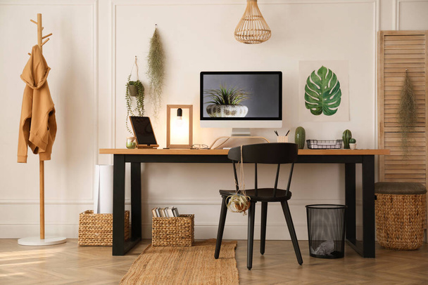Modern workplace with computer in room. Interior design - Foto, afbeelding