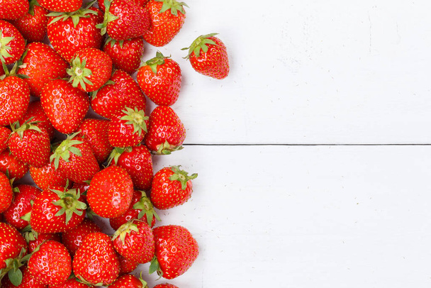 Strawberries berries fruits strawberry berry fruit copyspace copy space on a wooden board food - Foto, imagen