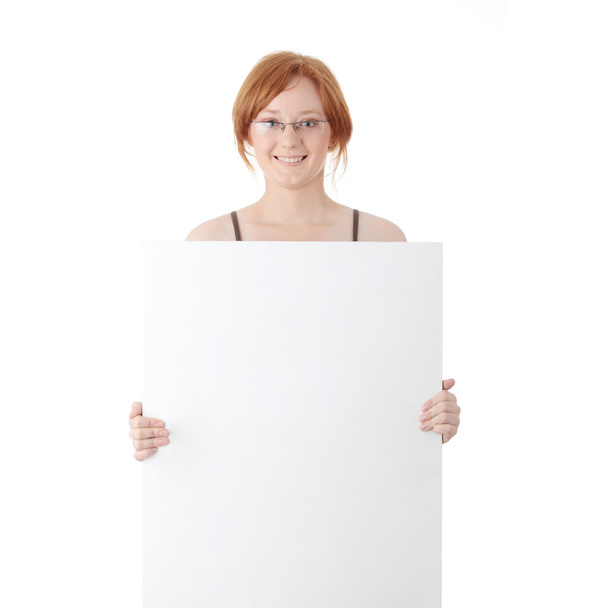Young redhead woman with blank board - Foto, imagen
