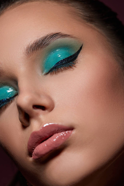 young woman with blue eye shadow makeup - Foto, Imagem