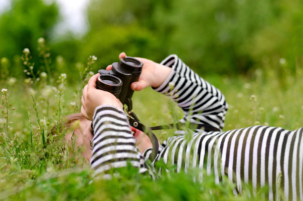 Young child using a pair of binoculars - Photo, Image