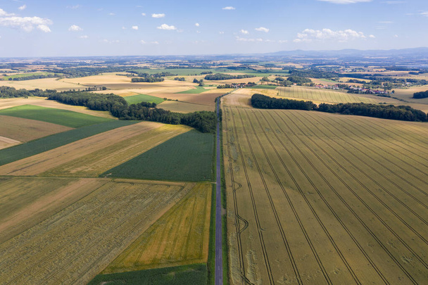 Village from drone aerial view. Beautiful village with houses and fields in Nysa, Poland. Polish farmland. - 写真・画像