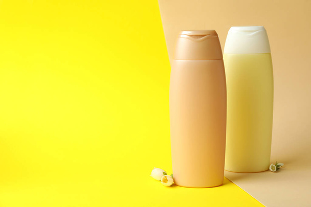 Blank bottles of shampoo on two tone background - Φωτογραφία, εικόνα