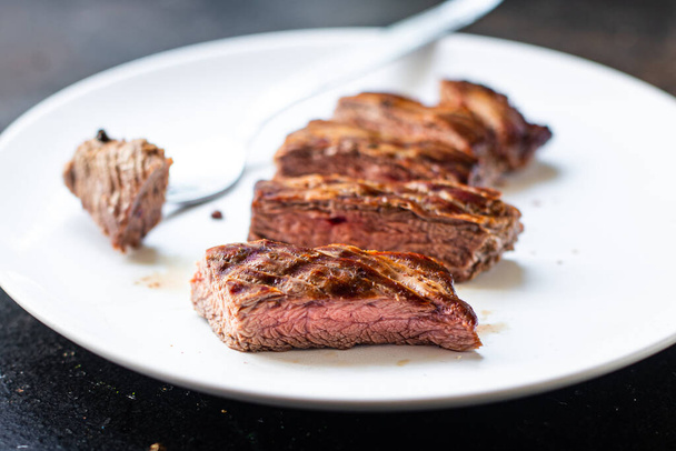 fresh steak beef juicy grilled meat barbecue portion B-B-Q on the table, healthy food meal snack copy space food background rustic. top view keto or paleo diet - Photo, image