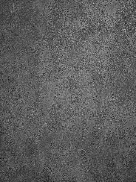 Háttér textúra egyenetlen sötét szürke beton vagy gipszfal felülete - Fotó, kép