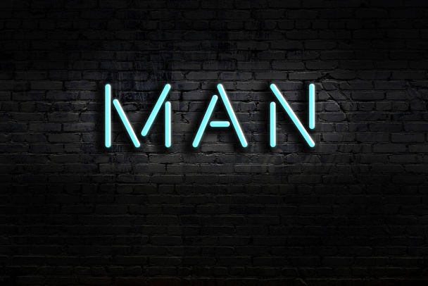 Neonový nápis na cihlové zdi v noci. Inscription man - Fotografie, Obrázek