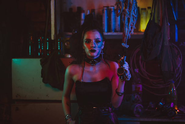 Cyberpunk cosplay. A girl with makeup and hair styling in a futuristic steampunk style - Photo, Image