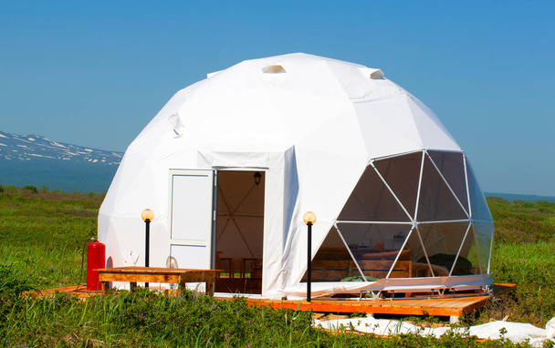 white geodome tent. Cozy glamping, holiday, vacation lifestyle concept. - Photo, Image