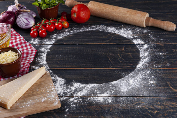 Wooden background with ingredients for pizza. Gray wood with red checkered napkin. Copy space. - Fotoğraf, Görsel