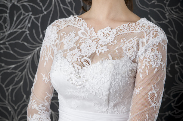 Lace white wedding dress closeup - Fotó, kép