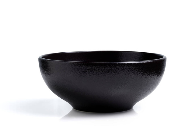 Empty black ceramic bowl isolated on white background - Photo, Image