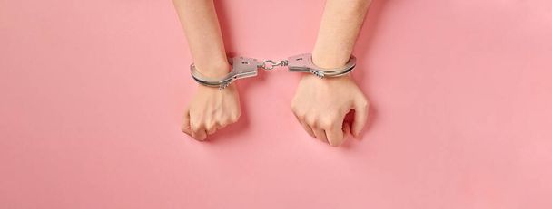 Male and female hands in handcuffs, copy space. Love forever. Prenuptial agreement, duties of love couple. - Foto, Bild