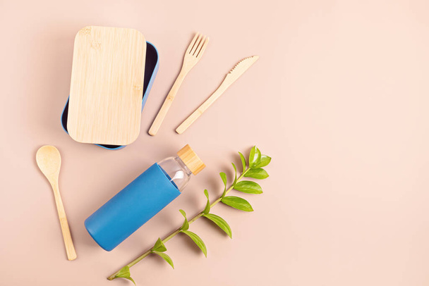 Zero waste kit for takeaway lunch, reusable bottle, box and bamboo cutlery. Sustainable lifestyle concept - Photo, image