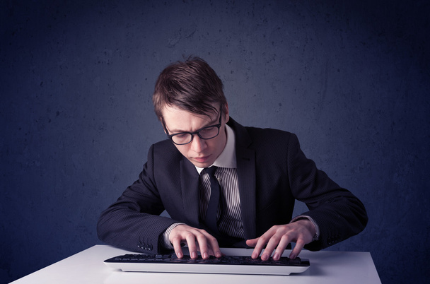 Hacker working with keyboard on blue background - Foto, Bild