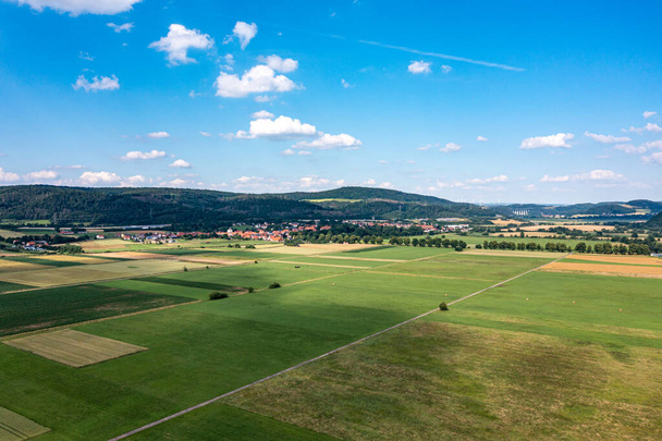 The landscape of the Werra Valley with the Werra River and agriculture fields at Herleshausen in Hesse and Thuringia - Photo, Image