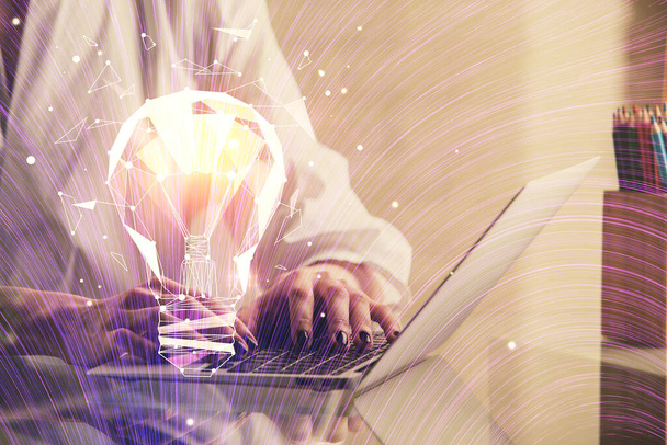 Double exposure of woman hands typing on computer and light bulb drawing. Idea concept. - Foto, Imagen