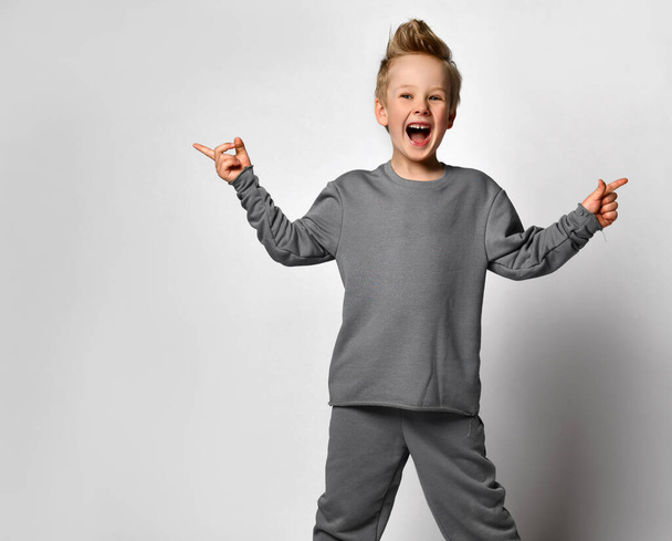 Little boy child with european appearance fooling around - 写真・画像