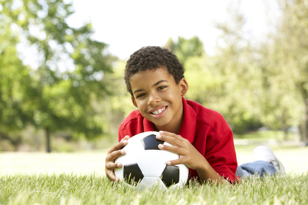Boy In Park With Football - Valokuva, kuva