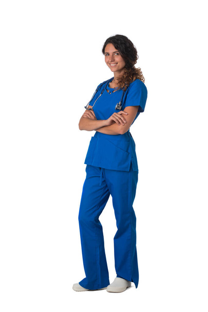 Nurse doctor woman smile with stethoscope stand with arms folded, wear blue surgery medical suit. Isolated on white background - Foto, afbeelding