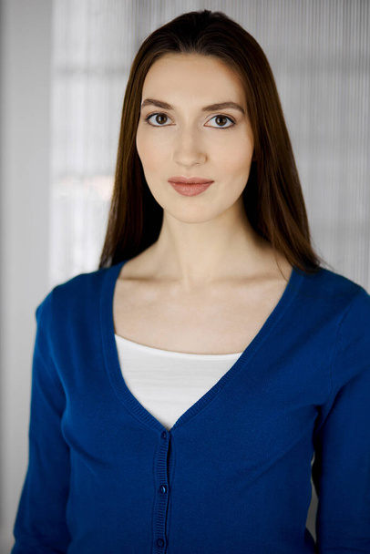 Asian casual dressed business woman standing straight. Business headshot or portrait in office - Valokuva, kuva