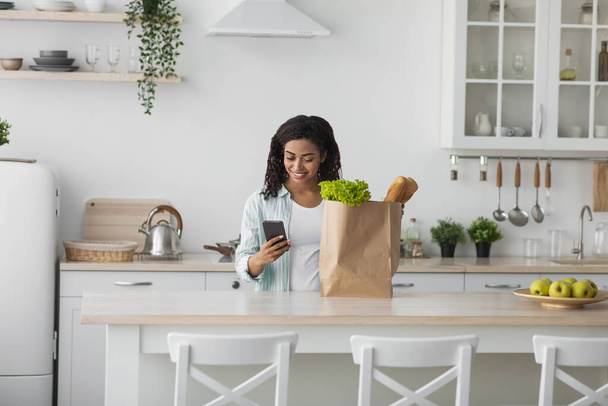 Young woman home with heavy grocery bag - Photo, Image