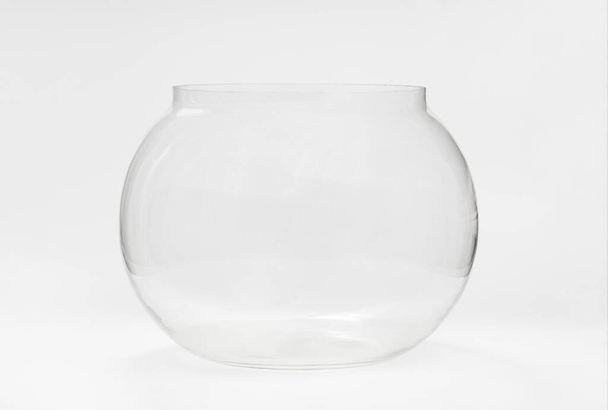 empty round glass aquarium. goods and accessories for pets. Aquarium for fish and as an element of decor, vase. - Photo, Image