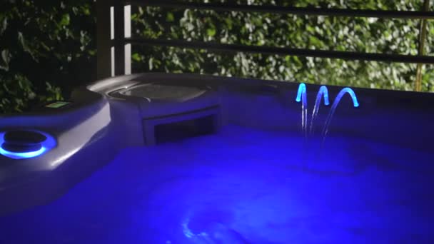 Cool Blue LED Illuminated and Running Home Garden Hot Tub Spa Inside Gazebos. - Πλάνα, βίντεο