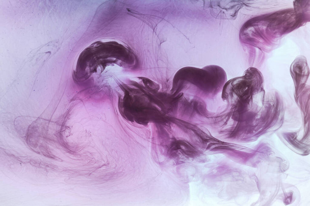Abstract pink purple cloud of smoke, paint in water background. Fluid art wallpaper, liquid vibrant bright colors. Concept aphrodisiac perfume - Foto, Imagem