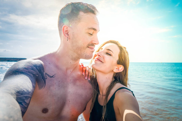 Happy young couple at the sea vacations - 写真・画像