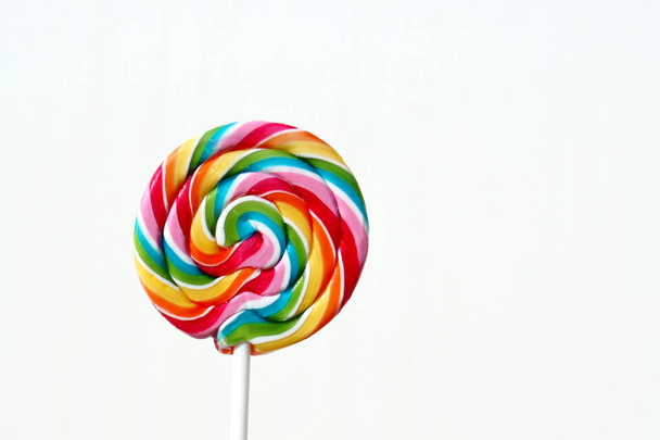 Colorful lollipop on a white background. Round multi-colored candy.  - Photo, Image