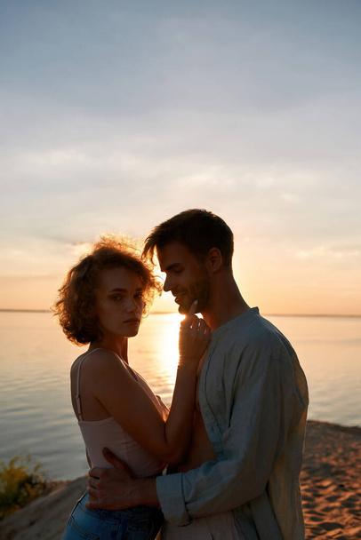 Portrait of tender young man and woman hugging - Fotografie, Obrázek