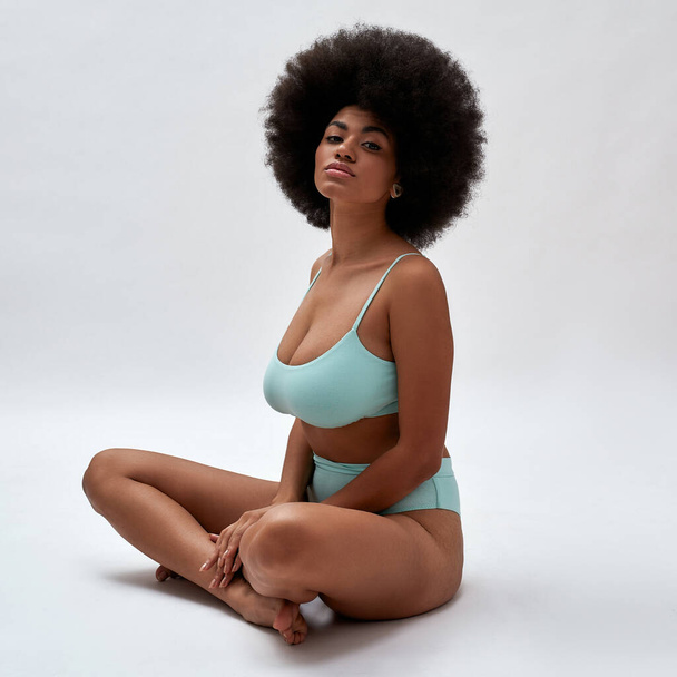 Tempting young african american woman in blue lingerie - Photo, image