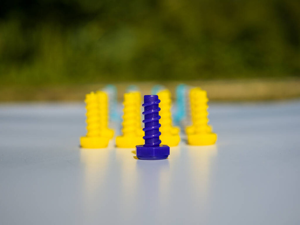 Front view of a squad of plastic multicolored cogs. - Photo, Image