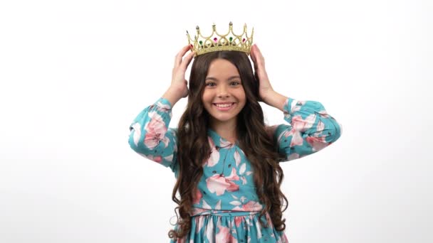 happy egocentric child in queen crown pointing thumb up on herself, egoistic - Záběry, video
