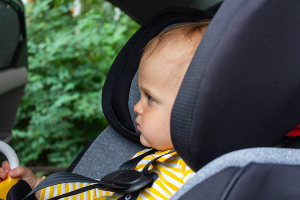 Baby boy in car seat. Child safety  - Fotoğraf, Görsel