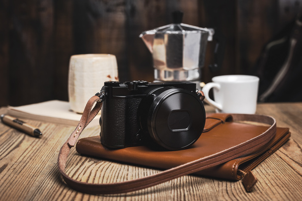 closeup vintage style of digital mirrorless camera with leather strap. - Photo, Image