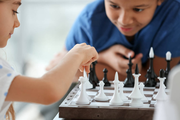 Cute children playing chess at home - Photo, Image