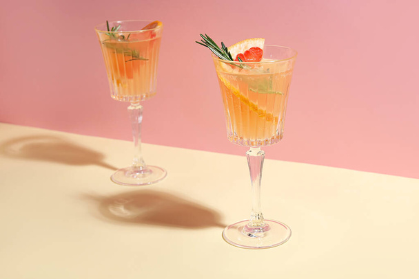 Glasses of tasty grapefruit cocktail on color background - Photo, image